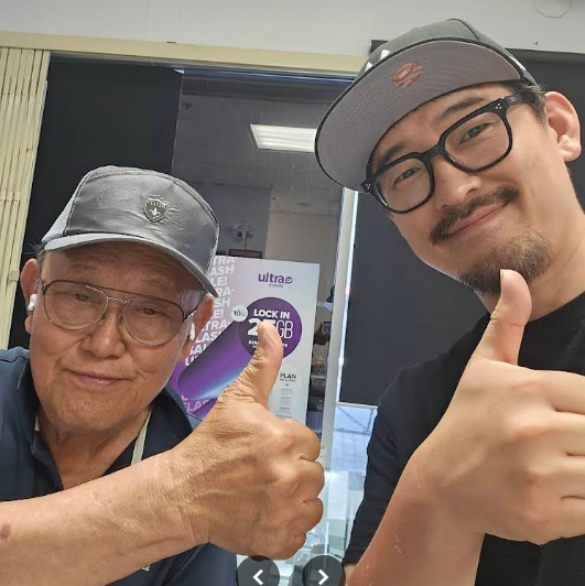 Customer smiling while receiving a fully restored Samsung device